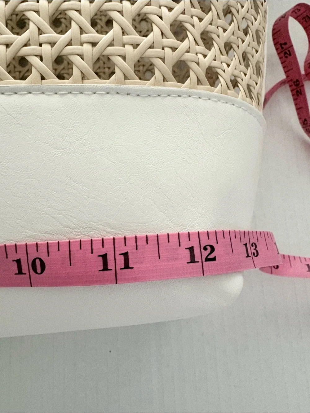 A New Day Straw Caning Tote Bag natural woven cane design white trim detailing.
